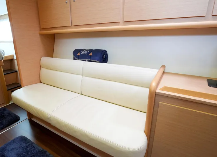 Bleu Lagoon Yacht Photos Pics Interior of 2012 Lagoon 421 yacht with beige seating and wooden cabinetry.
