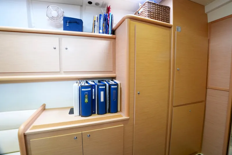 Bleu Lagoon Yacht Photos Pics Interior of 2012 Lagoon 421 yacht with wooden cabinets and organized storage.
