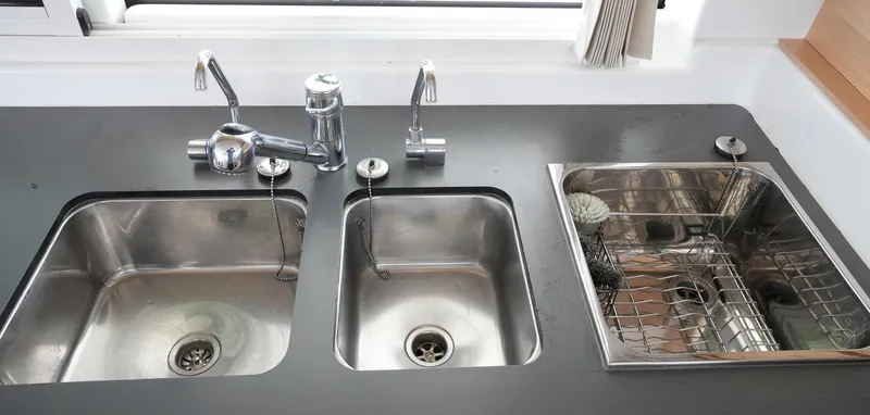 Bleu Lagoon Yacht Photos Pics Modern kitchen sink setup in 2012 Lagoon 421 yacht, featuring dual basins and sleek fixtures.