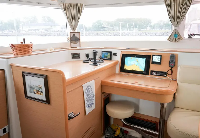 Bleu Lagoon Yacht Photos Pics Interior of 2012 Lagoon 421 yacht with navigation equipment and cozy seating area.