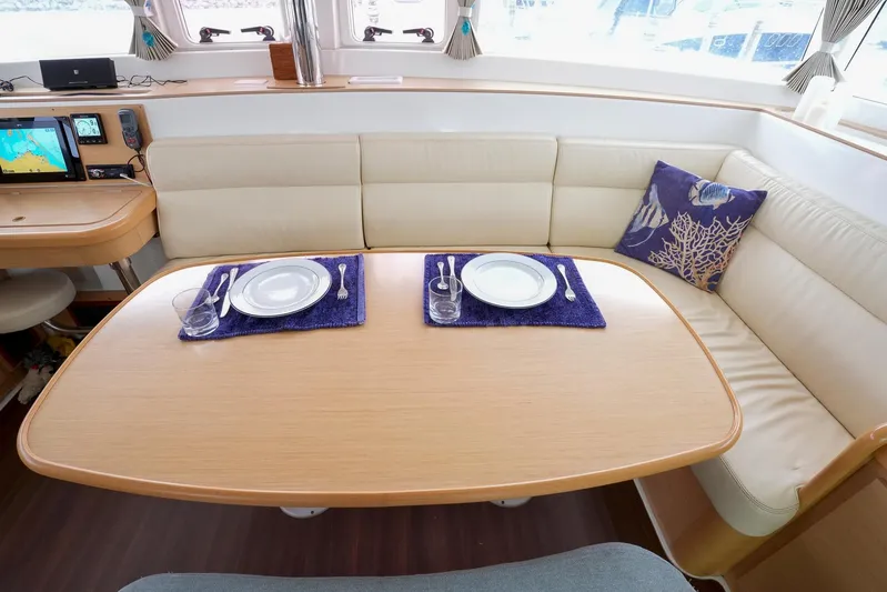 Bleu Lagoon Yacht Photos Pics Interior of 2012 Lagoon 421 yacht with dining table set for two.