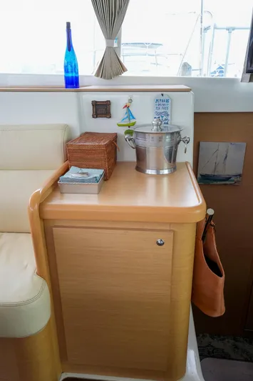 Bleu Lagoon Yacht Photos Pics Interior of 2012 Lagoon 421 yacht with wooden cabinetry and decorative items.