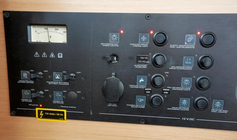 Bleu Lagoon Yacht Photos Pics Control panel of a 2012 Lagoon 421 yacht, featuring various switches and indicators.