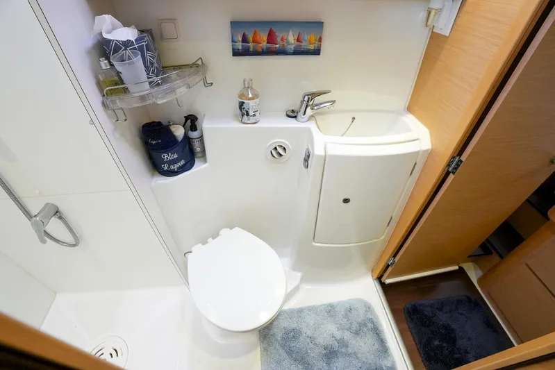 Bleu Lagoon Yacht Photos Pics Compact bathroom in 2012 Lagoon 421 yacht with shower, toilet, and sink.