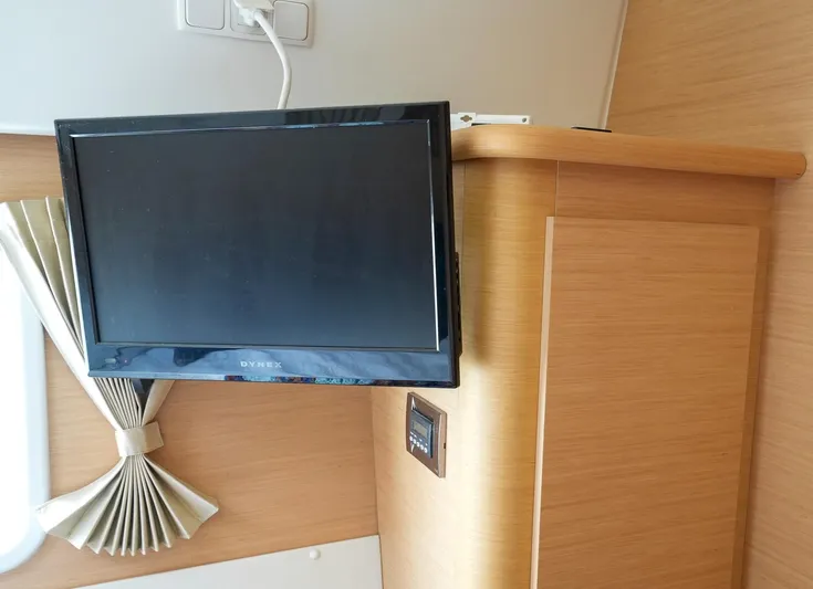 Bleu Lagoon Yacht Photos Pics Wall-mounted TV in a 2012 Lagoon 421 yacht interior.