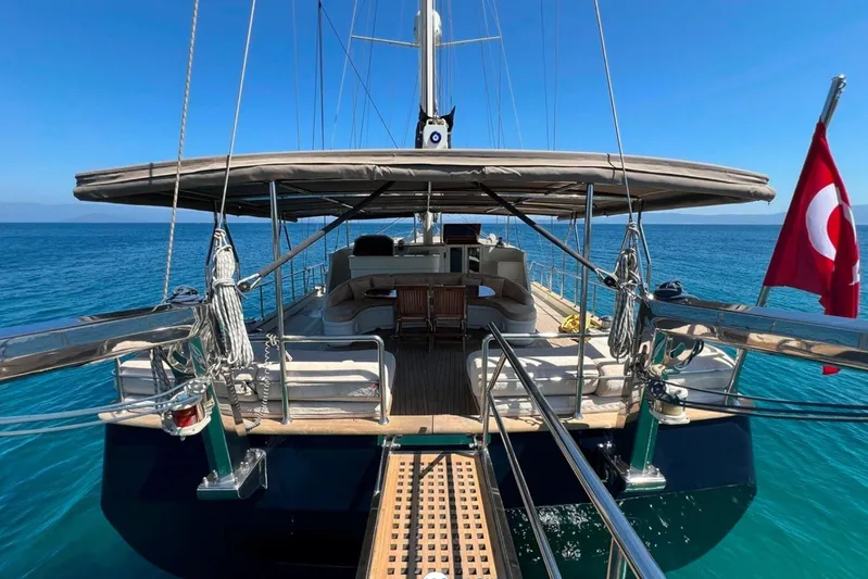 Cİca Sultan Yacht Photos Pics Luxurious 2014 Ark Yat 24M yacht with Turkish flag, sailing on clear blue waters.