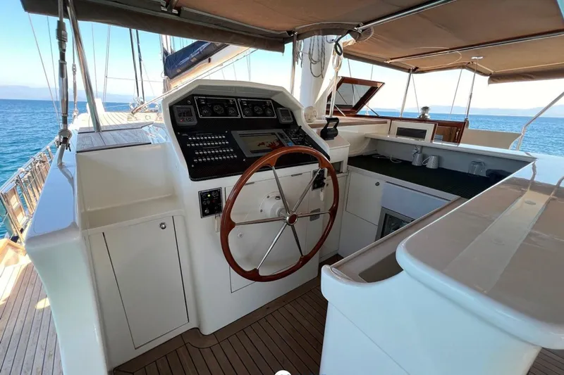 Cİca Sultan Yacht Photos Pics Luxurious Ark Yat 24M yacht helm, featuring modern controls and ocean view, 2014 model.