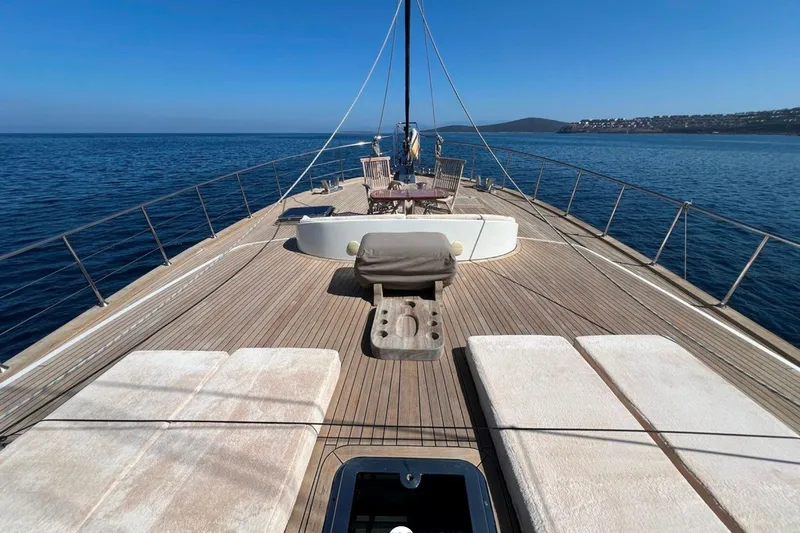 Cİca Sultan Yacht Photos Pics Luxurious Ark Yat 24M yacht deck with sun loungers, 2014 model, sailing on calm blue waters.