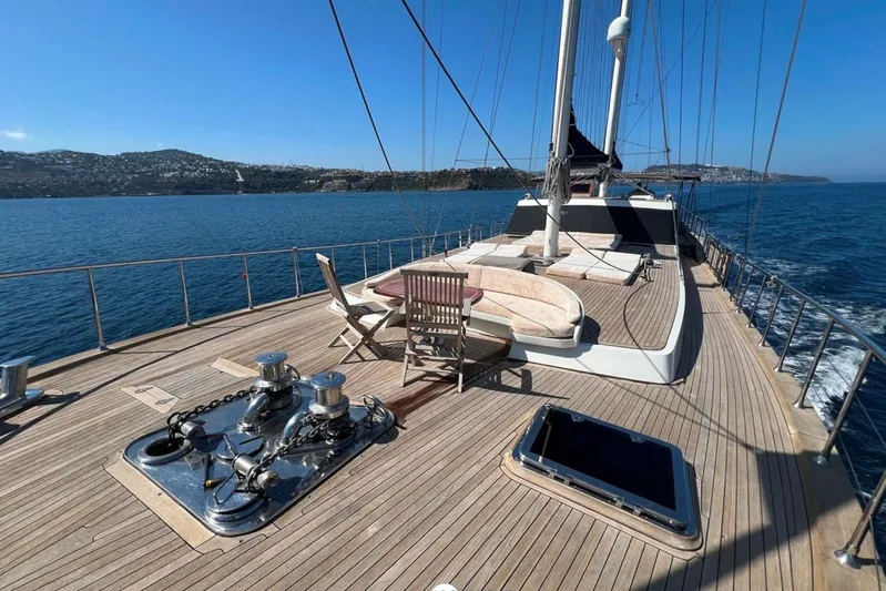 Cİca Sultan Yacht Photos Pics Luxurious 2014 Ark Yat 24M yacht deck with seating, sailing on blue waters.