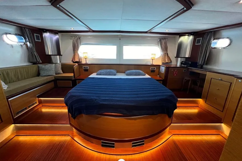 Cİca Sultan Yacht Photos Pics Luxurious Ark Yat 24M 2014 yacht bedroom with ambient lighting and elegant furnishings.