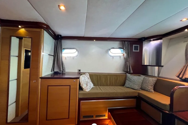 Cİca Sultan Yacht Photos Pics Luxurious interior of 2014 Ark Yat 24M yacht with cozy seating and elegant wood finishes.
