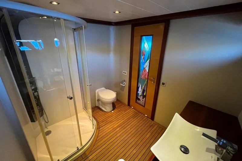 Cİca Sultan Yacht Photos Pics Luxurious bathroom on 2014 Ark Yat 24M yacht with shower and stained glass door.