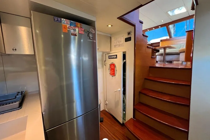 Cİca Sultan Yacht Photos Pics Interior of 2014 Ark Yat 24M yacht with kitchen and staircase.