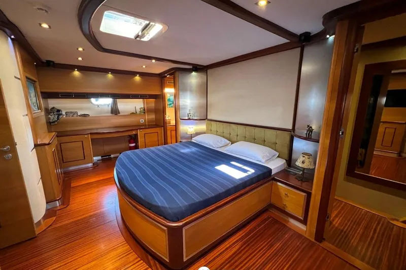 Cİca Sultan Yacht Photos Pics Luxurious Ark Yat 24M 2014 yacht bedroom with elegant wood finish and modern lighting.