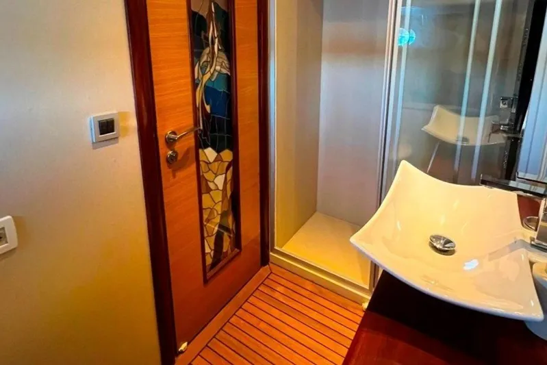 Cİca Sultan Yacht Photos Pics Luxurious Ark Yat 24M 2014 yacht bathroom with modern sink and stained glass door.