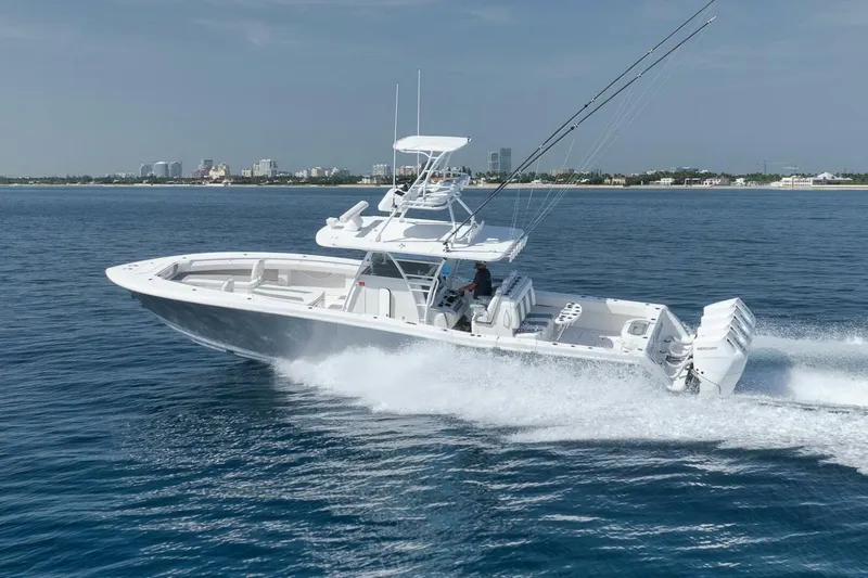 Good Times Yacht Photos Pics 2020 Invincible 42' Open Fisherman boat cruising on blue ocean waters.