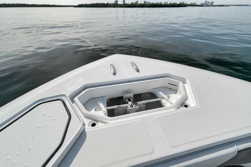 Good Times Yacht Photos Pics Bow of 2020 Invincible 42' Open Fisherman boat on calm water.