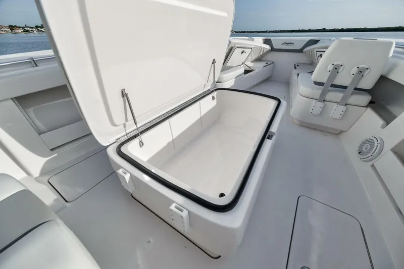 Good Times Yacht Photos Pics 2020 Invincible 42' Open Fisherman boat interior with open storage compartment.