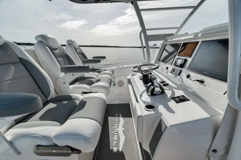 Good Times Yacht Photos Pics 2020 Invincible 42' Open Fisherman boat interior with modern helm and seating.