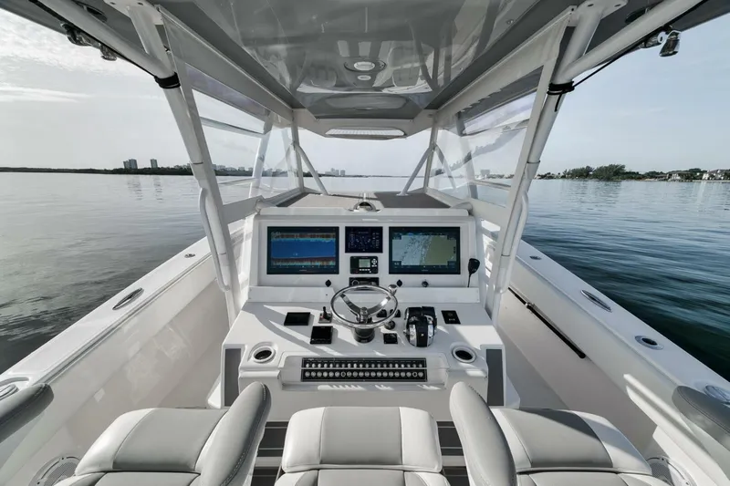 Good Times Yacht Photos Pics 2020 Invincible 42' Open Fisherman boat cockpit with modern navigation system.