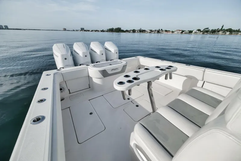 Good Times Yacht Photos Pics 2020 Invincible 42' Open Fisherman boat with quad Mercury engines on calm water.