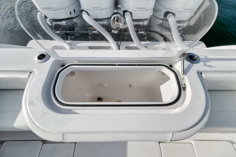 Good Times Yacht Photos Pics 2020 Invincible 42' Open Fisherman boat with open storage compartment and visible engines.