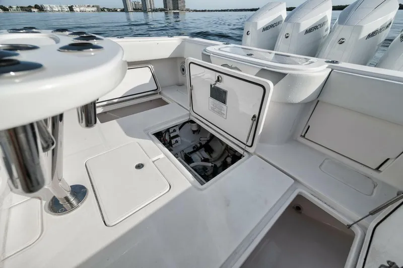 Good Times Yacht Photos Pics 2020 Invincible 42' Open Fisherman boat with open hatch and Mercury engines.