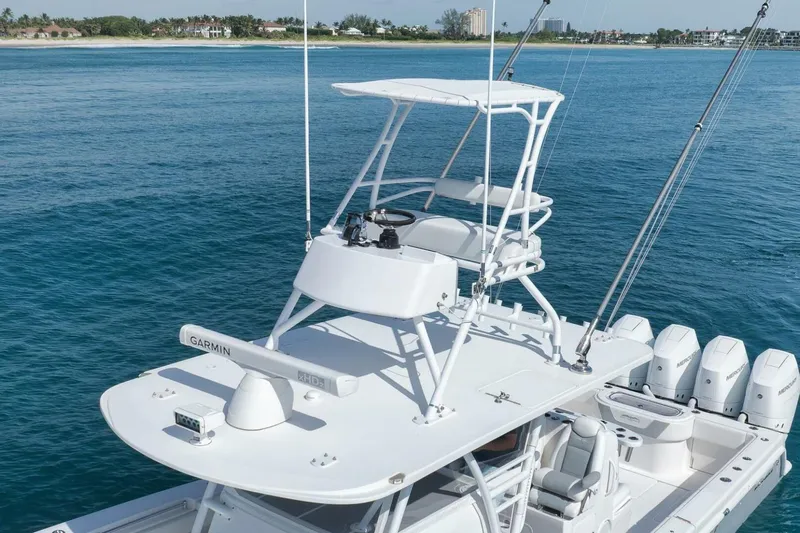 Good Times Yacht Photos Pics 2020 Invincible 42' Open Fisherman boat with Garmin equipment on blue ocean water.