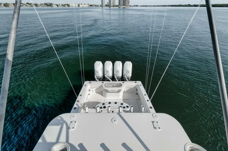 Good Times Yacht Photos Pics 2020 Invincible 42' Open Fisherman boat with four engines on calm water.