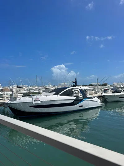  Yacht Photos Pics 2024 Azimut Verve 48 yacht docked in a sunny marina.