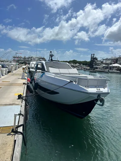  Yacht Photos Pics 2024 Azimut Verve 48 yacht docked at a marina under a clear blue sky.