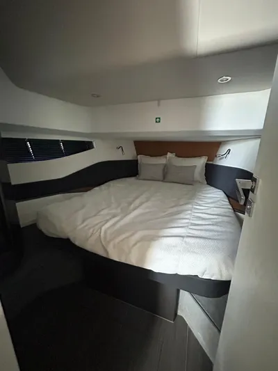  Yacht Photos Pics 2024 Azimut Verve 48 cabin interior with a cozy bed and modern design.