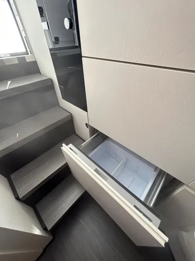  Yacht Photos Pics 2024 Azimut Verve 48 interior with open drawer and modern staircase design.