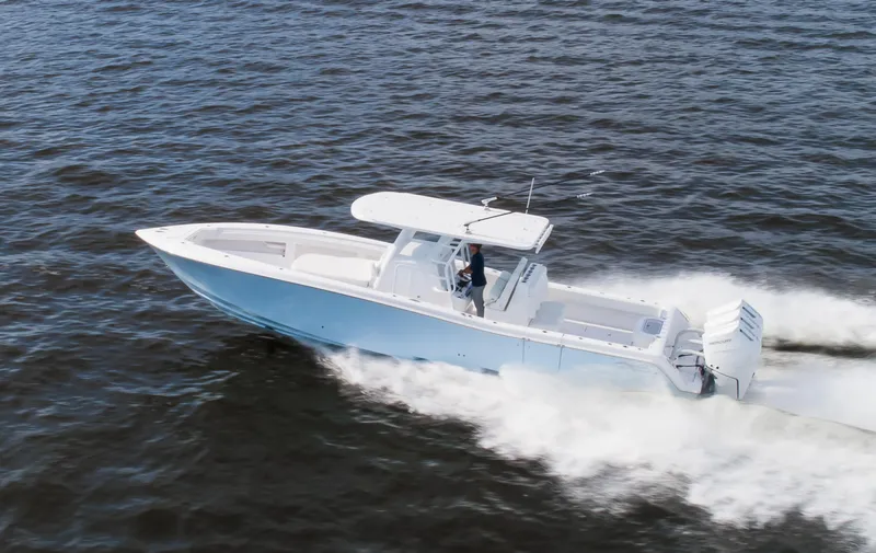  Yacht Photos Pics 2024 Invincible 39 Open Fisherman boat cruising on open water.