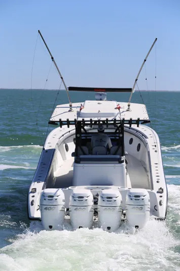  Yacht Photos Pics 2018 Yellowfin 39 boat with four engines cruising on open water.