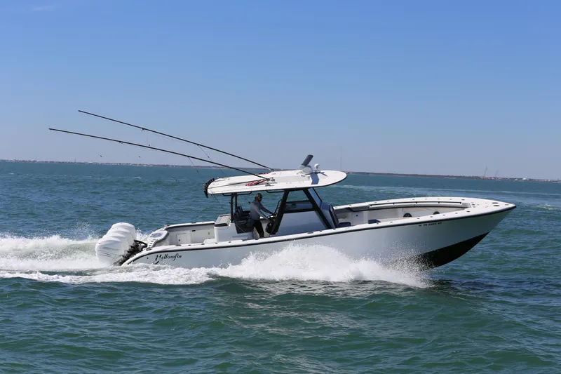  Yacht Photos Pics 2018 Yellowfin 39 boat cruising on open water under clear blue sky.