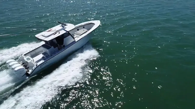  Yacht Photos Pics 2018 Yellowfin 39 boat cruising on open water, showcasing sleek design and powerful engines.