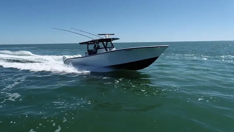  Yacht Photos Pics 2018 Yellowfin 39 boat cruising on open water under clear blue sky.