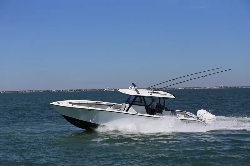  Yacht Photos Pics 2018 Yellowfin 39 boat cruising on open water under clear blue sky.