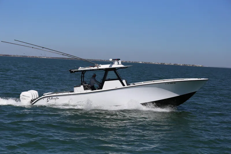  Yacht Photos Pics 2018 Yellowfin 39 boat cruising on open water under clear blue sky.