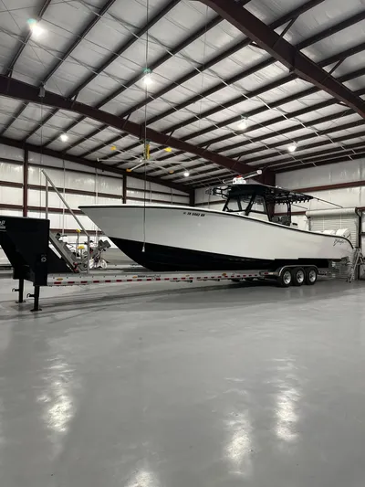  Yacht Photos Pics 2018 Yellowfin 39 boat on trailer inside a spacious warehouse.