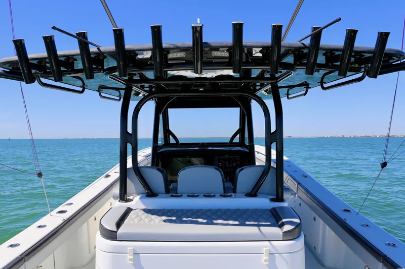  Yacht Photos Pics 2018 Yellowfin 39 boat on open water, featuring spacious seating and rod holders.