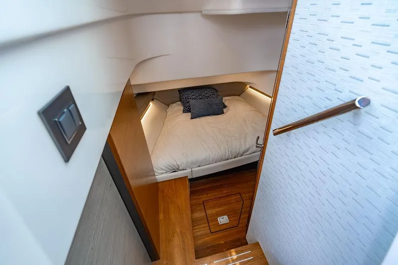 Let's Go Yacht Photos Pics 2023 Tiara Yachts 34 LS cabin interior with cozy bed and modern design.