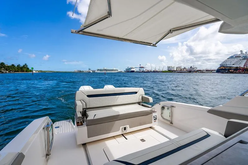 Let's Go Yacht Photos Pics 2023 Tiara Yachts 34 LS, luxury boat interior with ocean view and cruise ships.