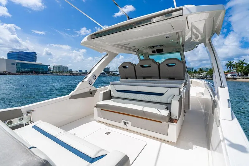 Let's Go Yacht Photos Pics 2023 Tiara Yachts 34 LS luxury boat interior with seating, ocean view, and modern design.
