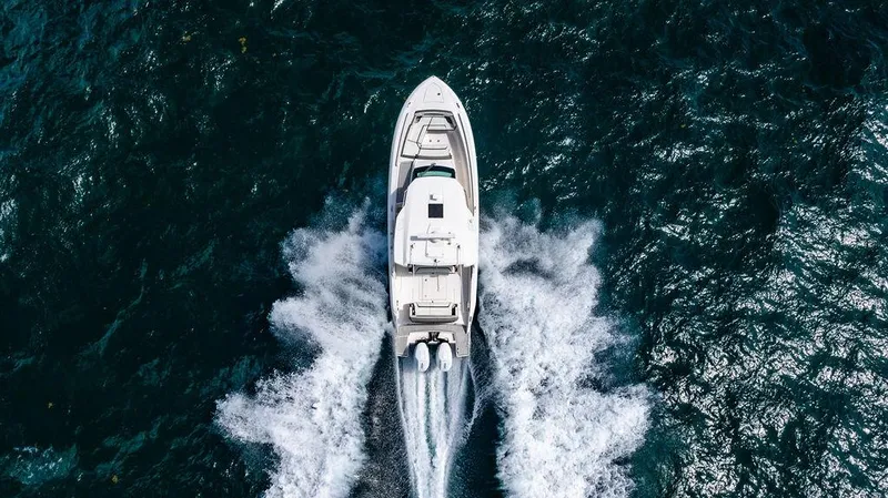 Let's Go Yacht Photos Pics Aerial view of 2023 Tiara Yachts 34 LS cruising on open water.