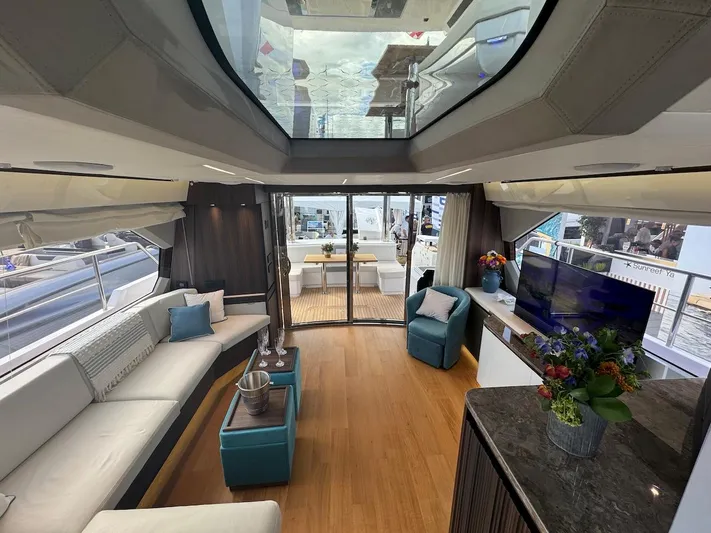 4 Stateroom Layout Yacht Photos Pics Luxurious interior of 2024 Aicon 66 Vivere yacht with modern furnishings and panoramic windows.