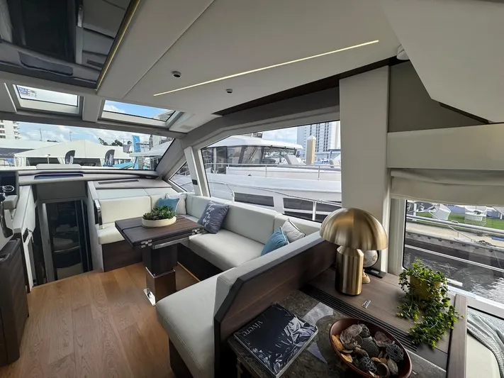 4 Stateroom Layout Yacht Photos Pics Luxurious interior of 2024 Aicon 66 Vivere yacht with modern decor and panoramic windows.