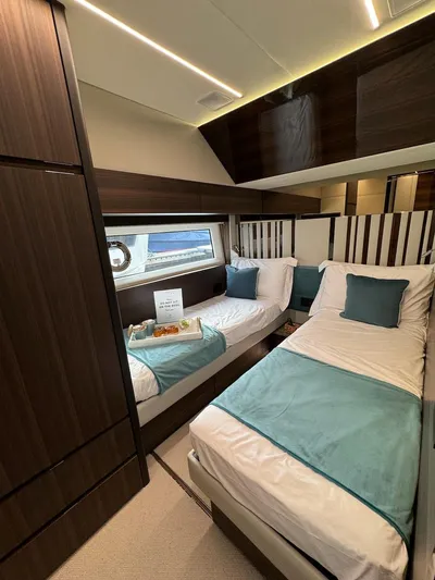 4 Stateroom Layout Yacht Photos Pics Luxurious 2024 Aicon 66 Vivere yacht cabin with twin beds and elegant decor.