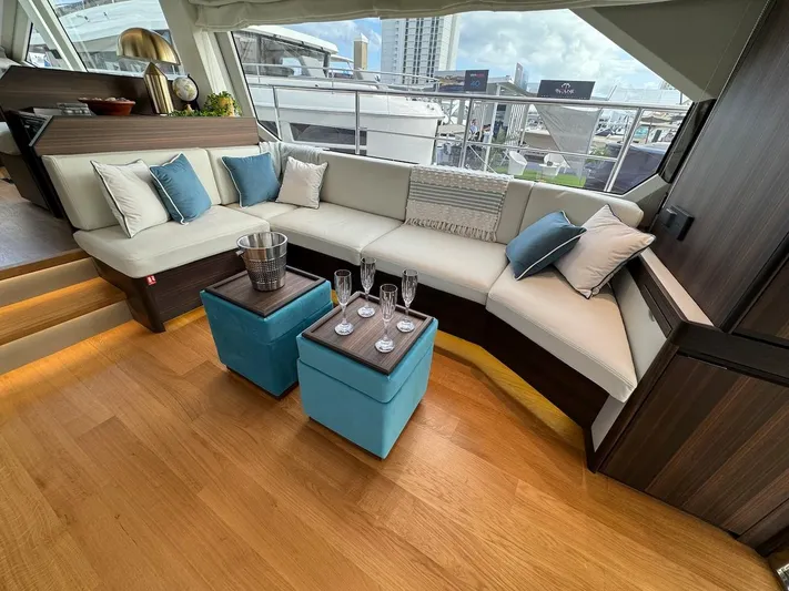 4 Stateroom Layout Yacht Photos Pics Luxurious interior of 2024 Aicon 66 Vivere yacht with elegant seating and decor.